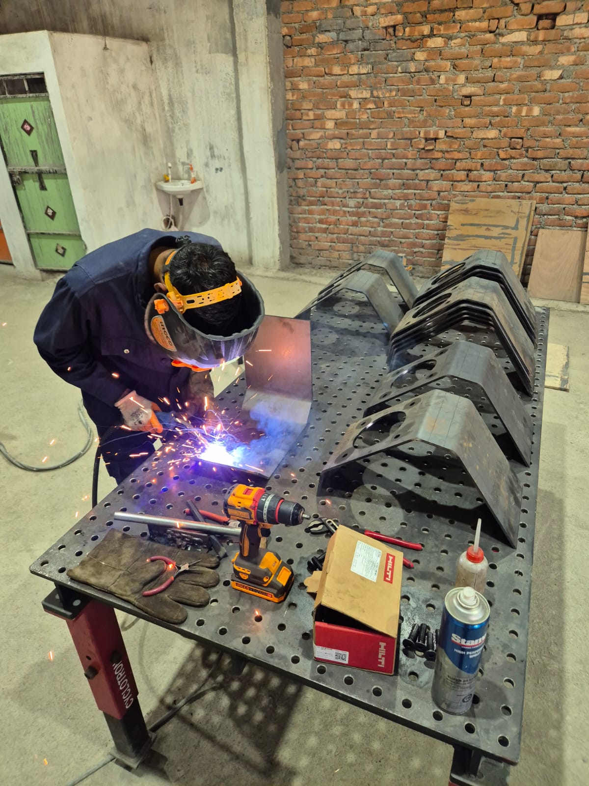 Welding sheet metal bracket and plate sub-assembly on fixture table