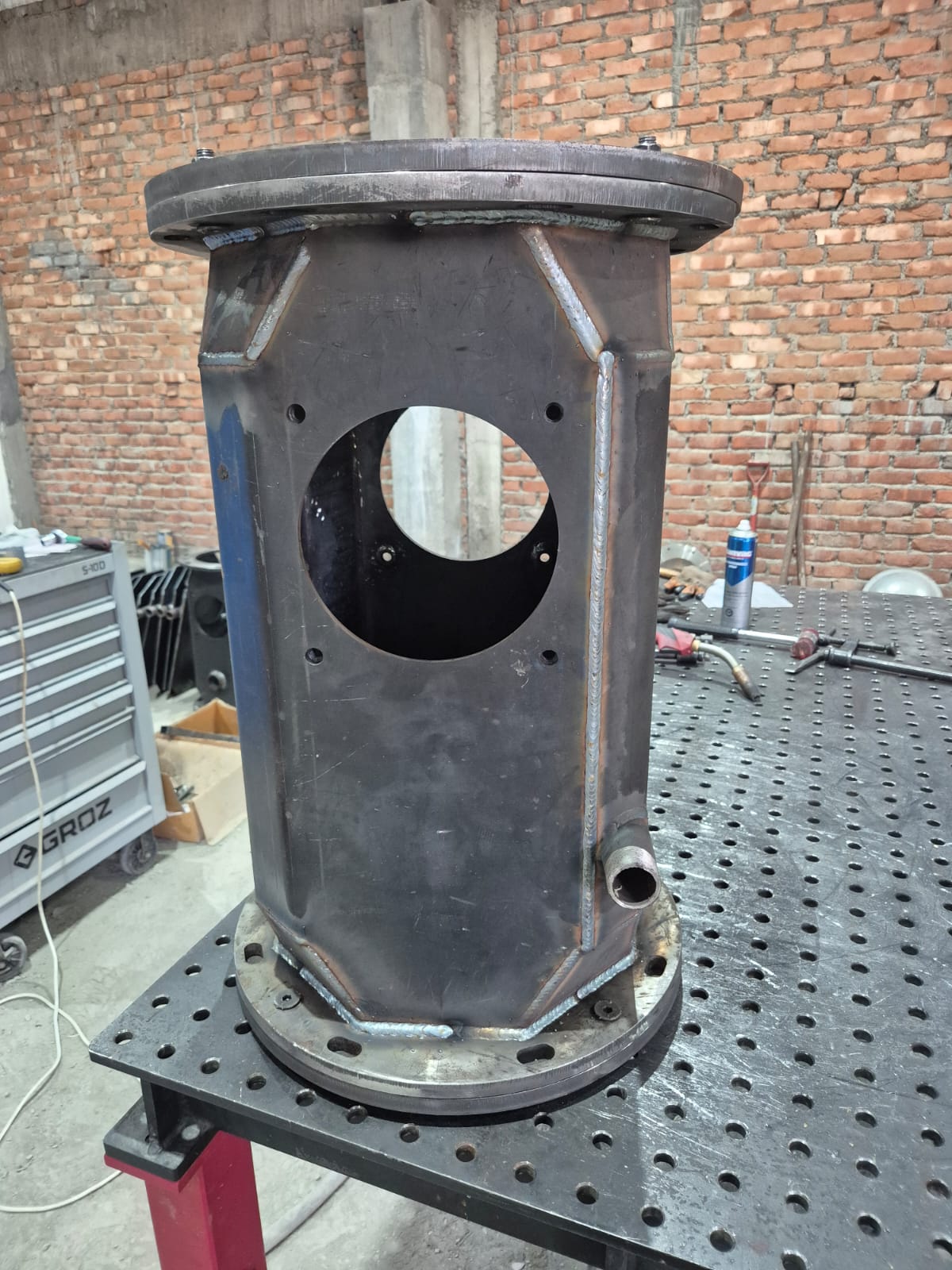 Single completed octagonal welded body on inspection table